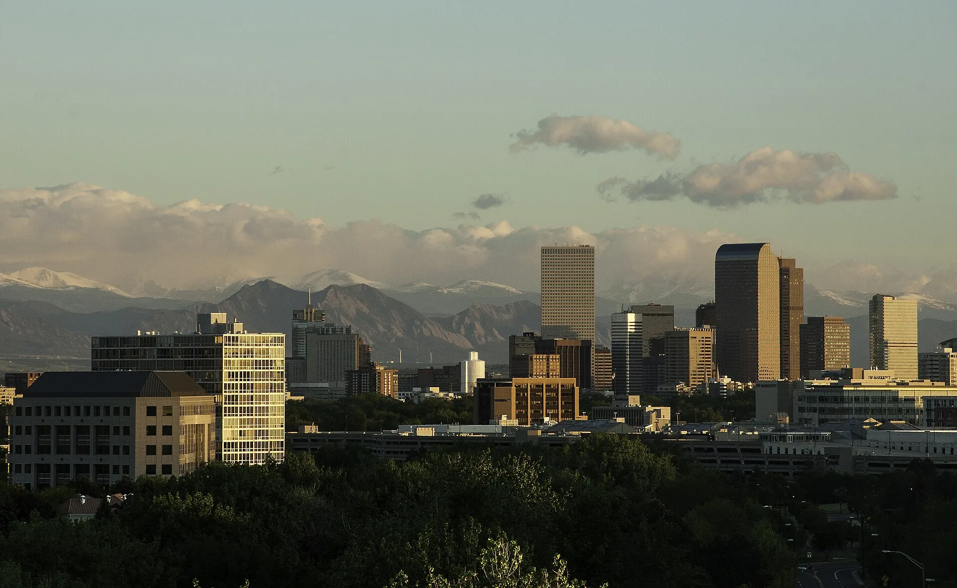 Denver skyline with the Rocky Mountains behind it