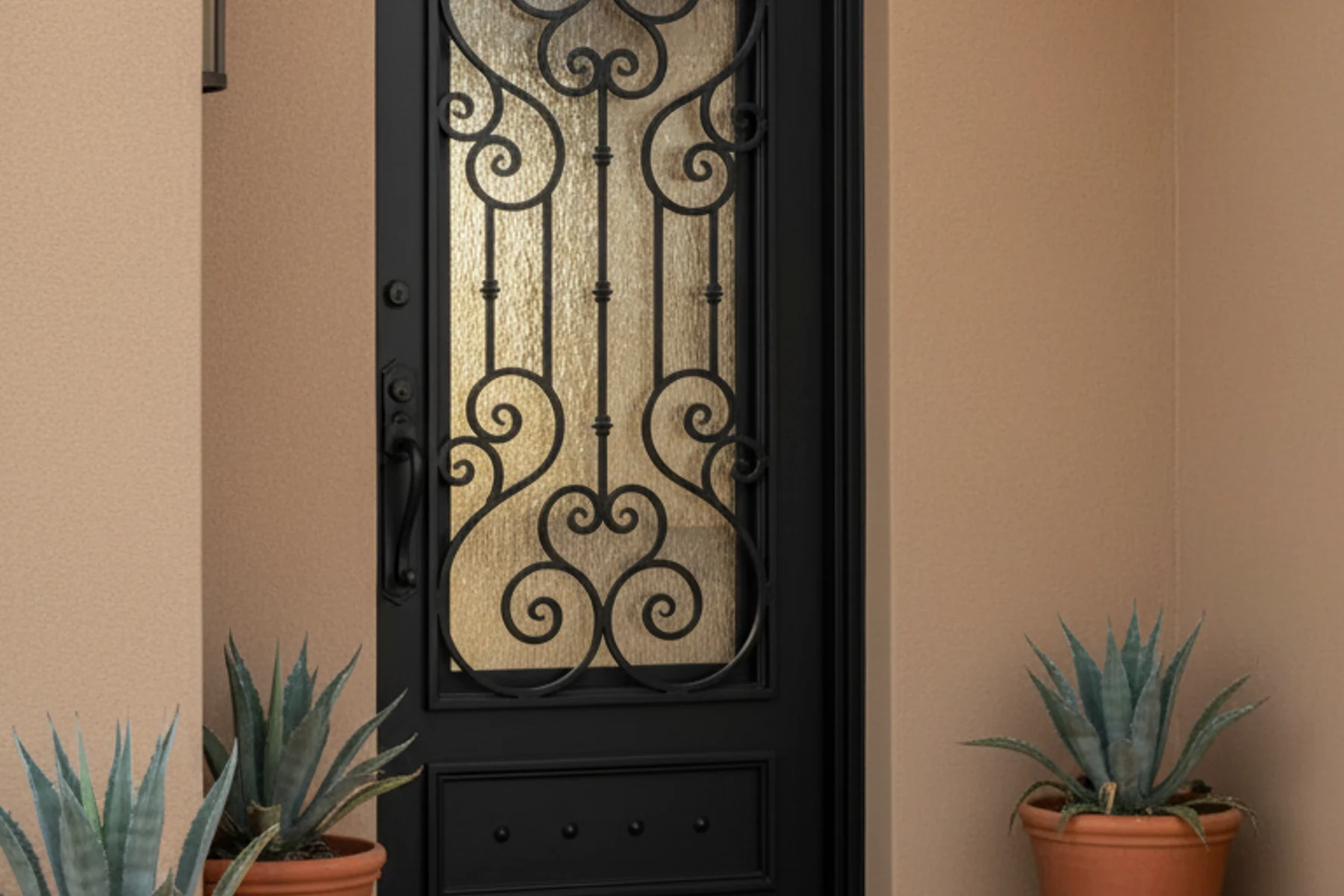 Dark bronze iron entry door installed on a custom home for a builder project